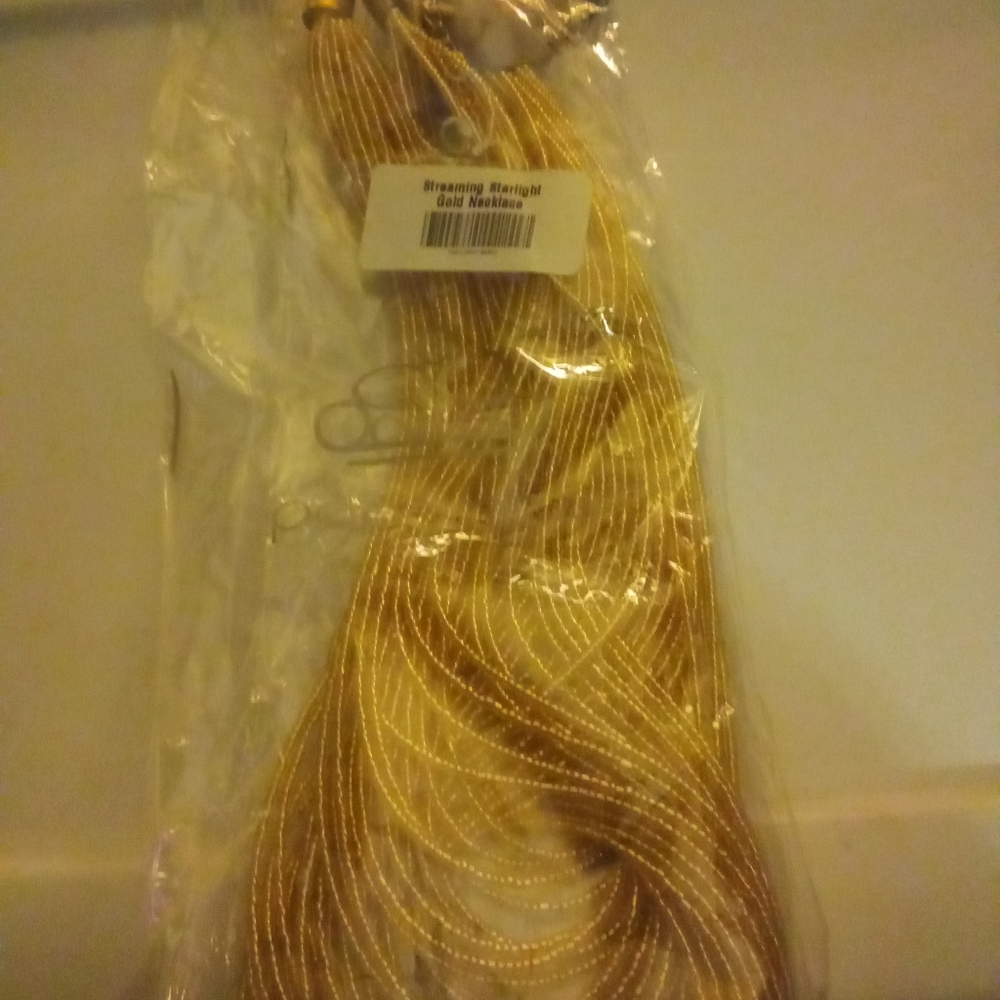 Streaming starlight gold necklace  with matching earrings from paparazzi